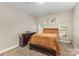 Cozy bedroom with neutral tones, comfortable bed, and ample natural light at 6912 Park Place Dr, Charlotte, NC 28262