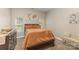 Charming bedroom featuring a plush bed, decorative accents, and bright windows at 6912 Park Place Dr, Charlotte, NC 28262