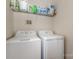 A laundry room with white walls features a washer and dryer at 6912 Park Place Dr, Charlotte, NC 28262