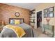 Charming bedroom featuring brick accent wall, and a walk-in closet at 7216 Old Valley Way, Harrisburg, NC 28075