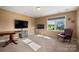 Spacious bonus room with a large window and neutral walls and carpet at 7216 Old Valley Way, Harrisburg, NC 28075