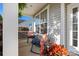 Cozy front porch with rocking chair and table, perfect for relaxing outdoors at 7216 Old Valley Way, Harrisburg, NC 28075