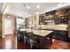 Spacious kitchen island with pendant lighting and countertop seating, perfect for entertaining at 7216 Old Valley Way, Harrisburg, NC 28075
