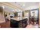 Open-concept kitchen with large island, granite countertops, and stainless steel appliances at 7216 Old Valley Way, Harrisburg, NC 28075