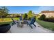 Backyard patio with a fire pit and Adirondack chairs for outdoor relaxation at 7216 Old Valley Way, Harrisburg, NC 28075