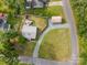 A bird's eye view of a fenced yard with a deck, storage shed, and convenient gravel parking at 804 Allen Dr, Marshville, NC 28103