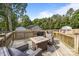 Inviting outdoor back deck with a firepit and comfortable seating for entertaining at 804 Allen Dr, Marshville, NC 28103