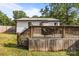 Backyard featuring a deck, wooden stairs, and grass at 804 Allen Dr, Marshville, NC 28103