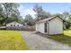 Exterior view of a garage, gravel driveway, and grass at 804 Allen Dr, Marshville, NC 28103