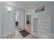 Hallway that features wood floors and offers entrances to a bedroom and bathroom at 804 Allen Dr, Marshville, NC 28103