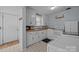 Cozy kitchen featuring white appliances, white cabinets and butcher block countertops at 804 Allen Dr, Marshville, NC 28103