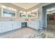 Bright bathroom featuring double sinks, vanities, and modern tile flooring, creating a clean and functional space at 8709 Barrelli Ct, Charlotte, NC 28277