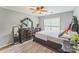 Comfortable bedroom with a wooden bed frame, neutral color scheme, and a large window at 8709 Barrelli Ct, Charlotte, NC 28277