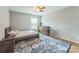 Cozy bedroom with modern decor, including a colorful rug and stylish furnishings at 8709 Barrelli Ct, Charlotte, NC 28277