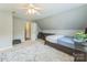 Neutral bedroom featuring a sloped ceiling, a ceiling fan, and plenty of room for furniture at 8709 Barrelli Ct, Charlotte, NC 28277