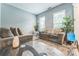 Bright living area with comfortable sofas, a decorative rug, and plenty of natural light at 8709 Barrelli Ct, Charlotte, NC 28277
