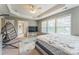 Bright and spacious primary bedroom with modern decor and a doorway to a bathroom at 8709 Barrelli Ct, Charlotte, NC 28277