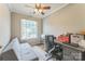 Comfortable office space featuring a daybed, desk, large window, and neutral color scheme at 8709 Barrelli Ct, Charlotte, NC 28277