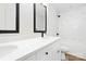 Elegant bathroom featuring double vanities with black faucets and a marble shower at 8717 Lawyers Rd, Charlotte, NC 28227