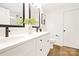 Elegant bathroom featuring a double vanity, sleek faucets, and modern finishes at 8717 Lawyers Rd, Charlotte, NC 28227