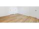 Empty bedroom with hardwood floors and a double door closet at 8717 Lawyers Rd, Charlotte, NC 28227
