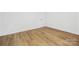 Bright, spacious bedroom featuring clean white walls and stylish wood-look flooring at 8717 Lawyers Rd, Charlotte, NC 28227