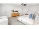 Bedroom featuring a ceiling fan, neutral carpet, and a large window for plenty of sunlight at 8717 Lawyers Rd, Charlotte, NC 28227