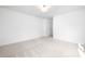 Bright bedroom featuring plush carpet and neutral walls at 8717 Lawyers Rd, Charlotte, NC 28227