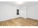 Bright bedroom with white walls, a window and natural light, and closet for ample storage at 8717 Lawyers Rd, Charlotte, NC 28227