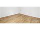 Empty bedroom features a door and hardwood floors at 8717 Lawyers Rd, Charlotte, NC 28227