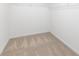 Walk-in closet is carpeted and has wire shelves for organization at 8717 Lawyers Rd, Charlotte, NC 28227