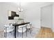 Bright dining room features modern decor and hardwood floors at 8717 Lawyers Rd, Charlotte, NC 28227