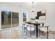 Bright dining room features modern decor and sliding glass doors to outdoor space at 8717 Lawyers Rd, Charlotte, NC 28227