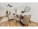 Open-concept layout showcases a living area flowing seamlessly into a dining space, brightened by natural light at 8717 Lawyers Rd, Charlotte, NC 28227