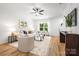 Comfortable living room with neutral color palette, stylish furnishings, and hardwood flooring at 8717 Lawyers Rd, Charlotte, NC 28227
