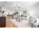 Bright, open-concept living room featuring modern decor, hardwood floors, and ample natural light at 8717 Lawyers Rd, Charlotte, NC 28227