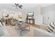 Open-concept living room featuring hardwood floors and flows to the kitchen and dining area at 8717 Lawyers Rd, Charlotte, NC 28227