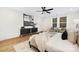 Spacious main bedroom with large windows, ceiling fan, and decorative accents at 8717 Lawyers Rd, Charlotte, NC 28227