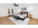 Spacious main bedroom features a ceiling fan, large windows, and decorative accents at 8717 Lawyers Rd, Charlotte, NC 28227