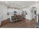 Bright kitchen with white cabinets, stainless steel appliances, and a large island at 1005 Cheviot Ct, Waxhaw, NC 28173