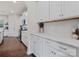 Well-lit kitchen with white cabinets, quartz countertops, and stainless steel appliances at 1005 Cheviot Ct, Waxhaw, NC 28173