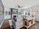 Living room with fireplace, built-in shelving, hardwood floors, and comfortable seating at 1005 Cheviot Ct, Waxhaw, NC 28173