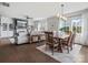 Open concept living and dining area is flooded with natural light and features hardwood floors at 1005 Cheviot Ct, Waxhaw, NC 28173