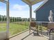 Screened patio with furniture overlooking a well-maintained lawn and fence at 1005 Cheviot Ct, Waxhaw, NC 28173