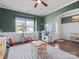 Open playroom features hardwood floors, natural light, and easy access to entryway at 1005 Cheviot Ct, Waxhaw, NC 28173
