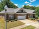Beautiful single-story home with brick facade, attached garage, and well-maintained landscaping at 10727 Ryan Courtney Sq, Mint Hill, NC 28227
