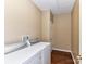 Laundry room features wood flooring and white washer and dryer appliances at 10727 Ryan Courtney Sq, Mint Hill, NC 28227