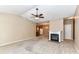 Inviting living room features carpet, fireplace, and an open layout connecting to kitchen and dining area at 10727 Ryan Courtney Sq, Mint Hill, NC 28227