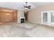 Open concept living space with vaulted ceiling, fireplace, access to outdoor and dining areas at 10727 Ryan Courtney Sq, Mint Hill, NC 28227