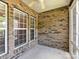 The outdoor patio features brick walls, large windows and plenty of natural light at 10727 Ryan Courtney Sq, Mint Hill, NC 28227